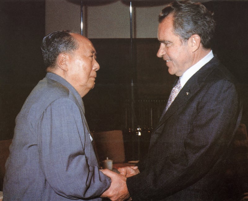 Chinese leader Chairman Mao Zedong welcomes President Richard Nixon in Beijing, Feb. 22, 1972.
