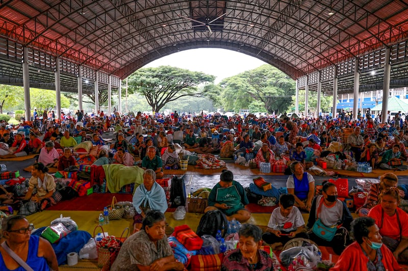 People rest inside a temporary shelter in Sisaket province, Thailand, July 26, 2025.