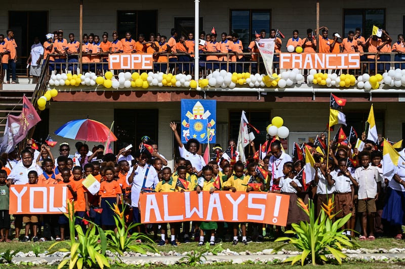 Students hold signs to welcome Pope Francis in Vanimo, Papua New Guinea, on Sept. 8, 2024.